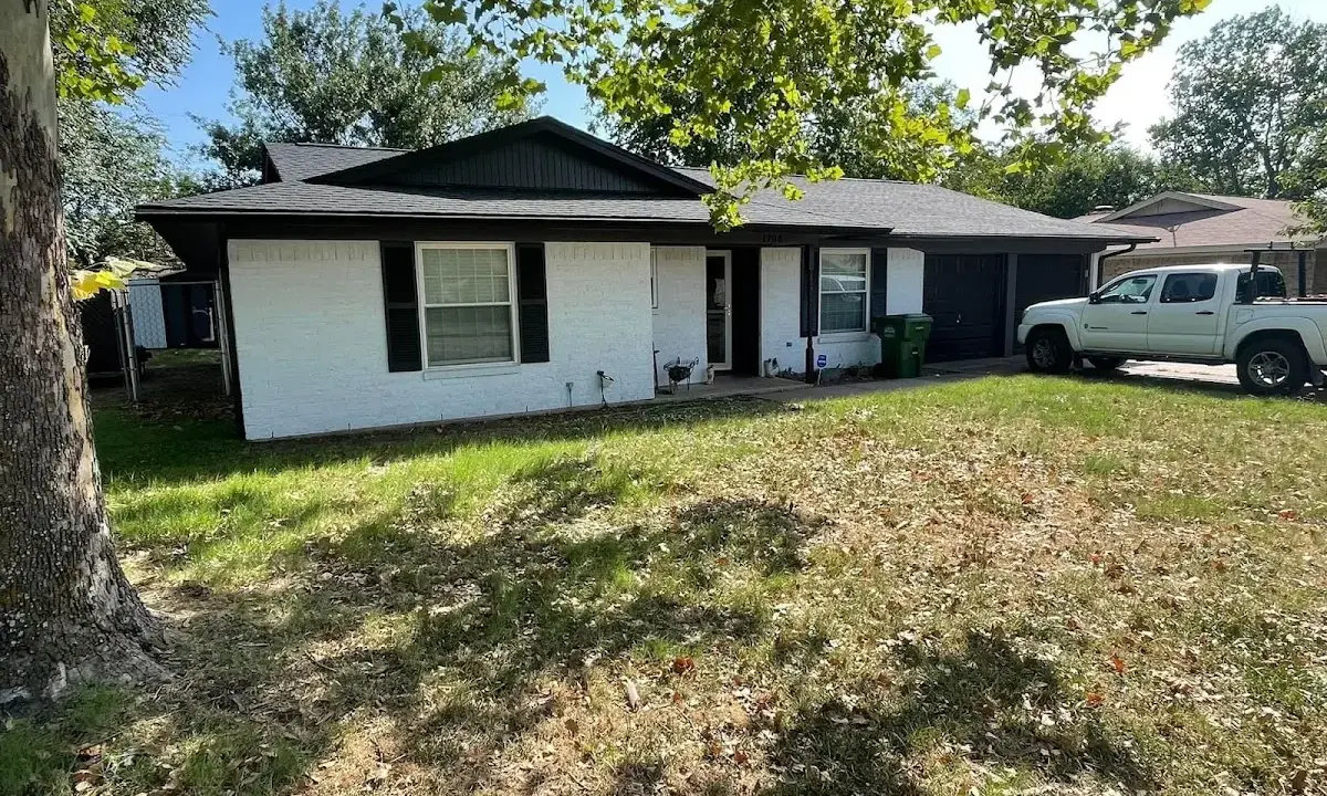 Professional roofing crew working on a residential roof in Bostonia
